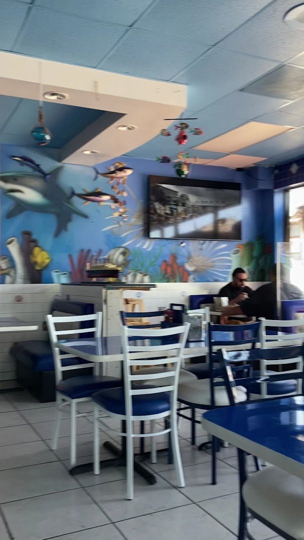 Fresh seafood dishes served with bright garnishes.